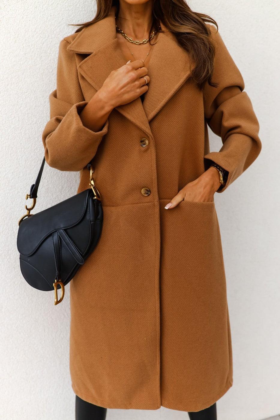 Tan long wool coat with notch lapels, button front, and flap double pockets