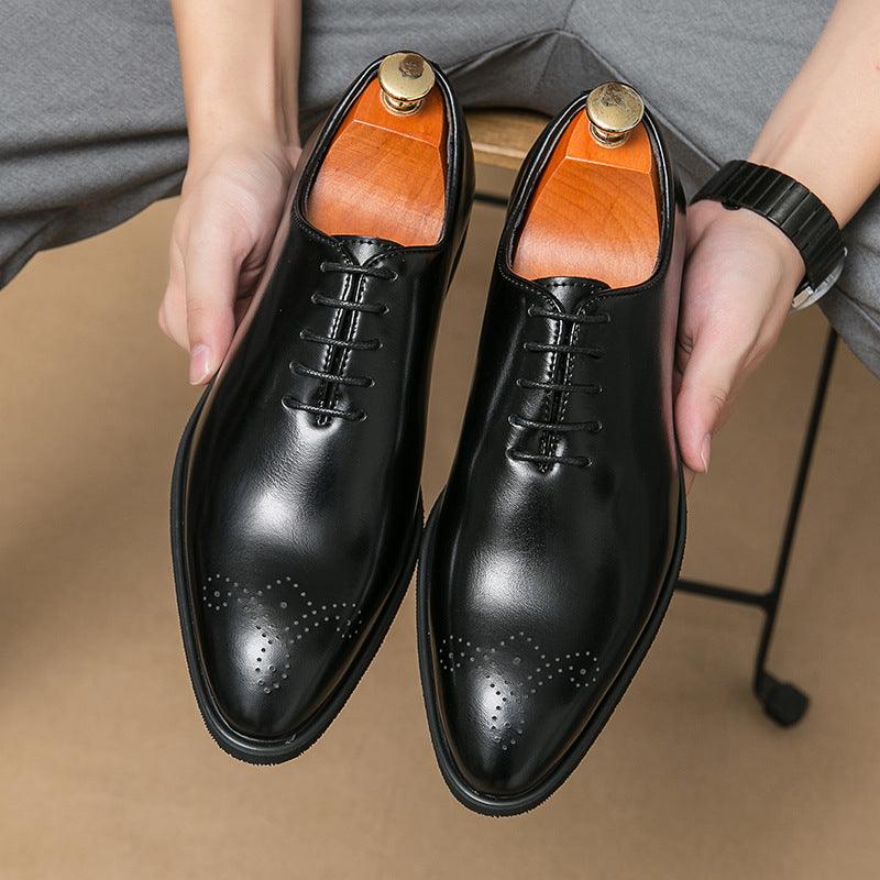 Men's black leather lace-up dress shoes with wingtip brogue perforations