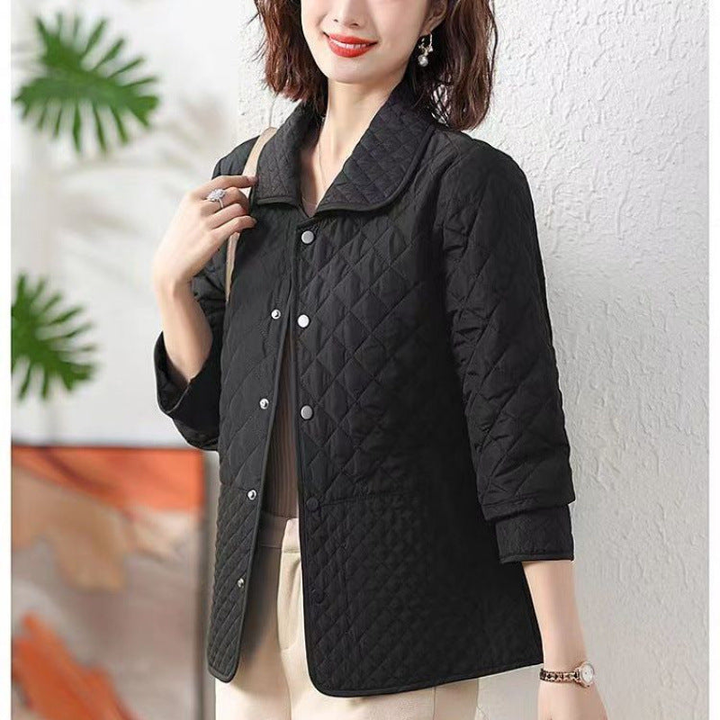 Black quilted short jacket with front buttons and stand collar