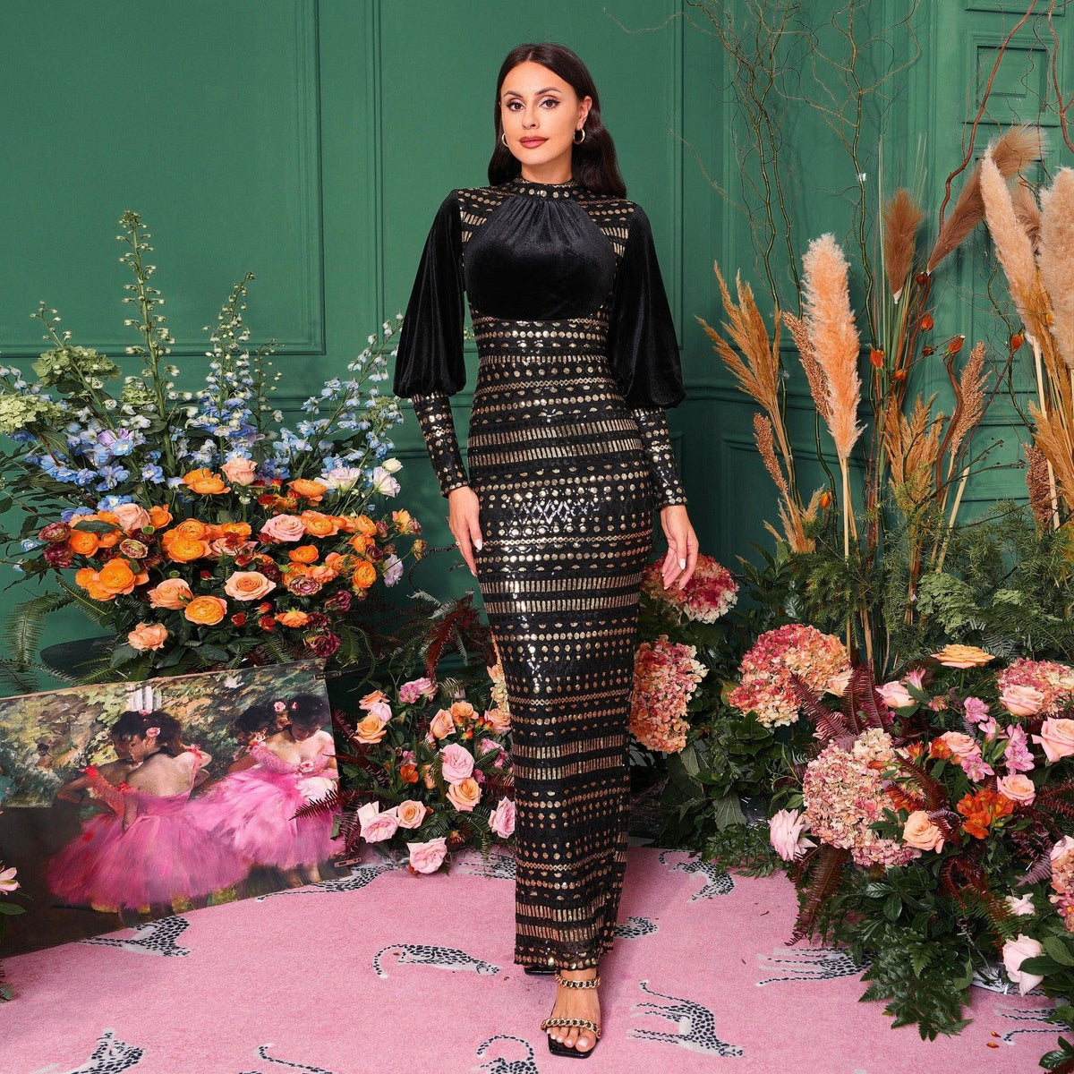 Black sequined slit evening dress with long sleeves and high round neckline.