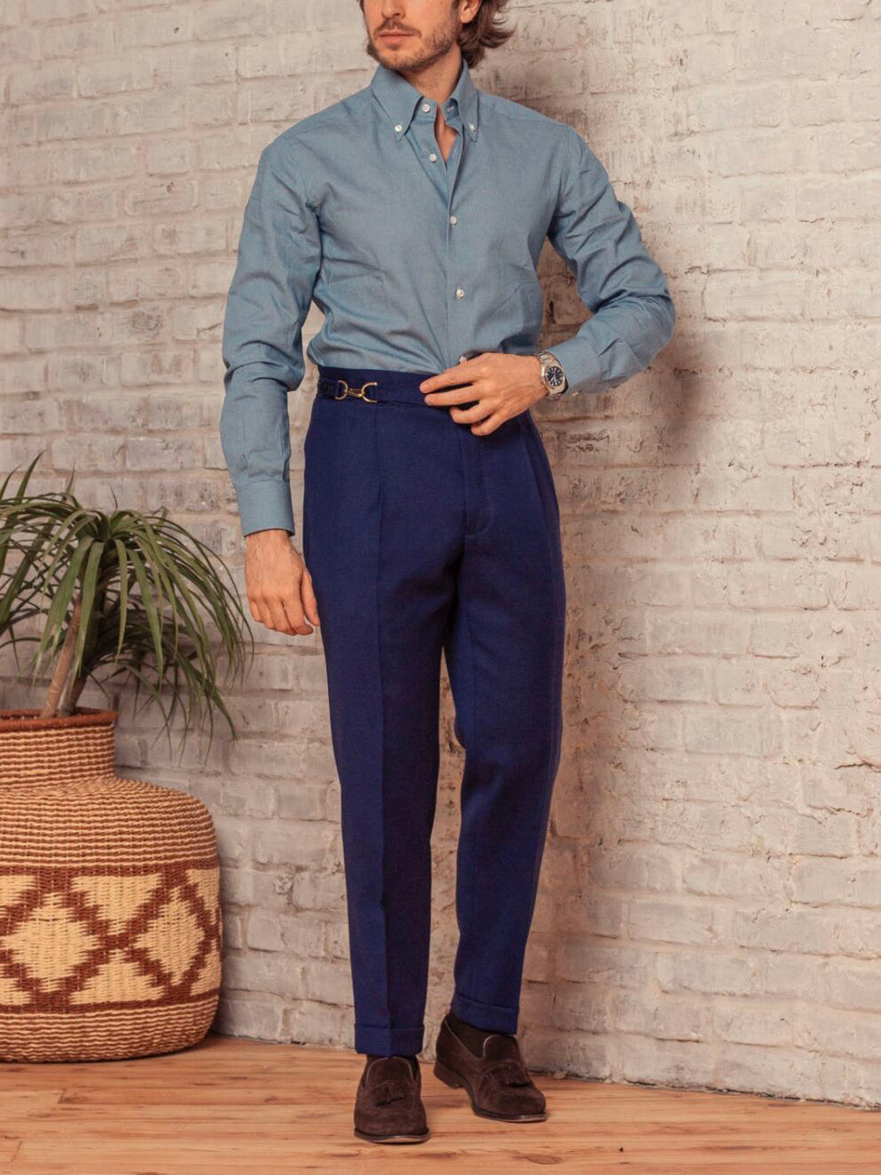 Men's classic button-down pants in navy blue with belt loops and pleated front