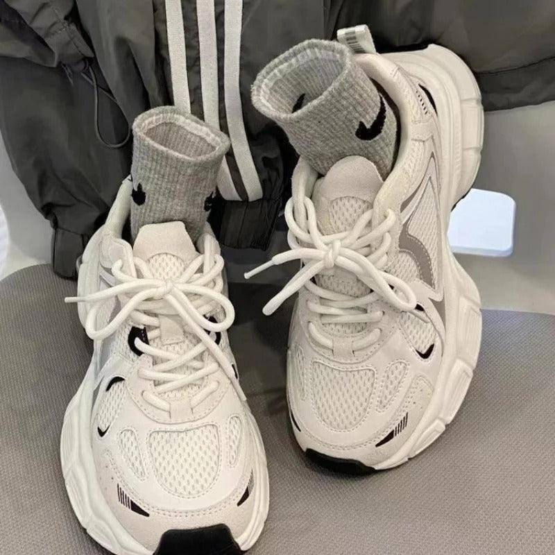 Light beige mesh platform sneakers with white laces and black logo accents