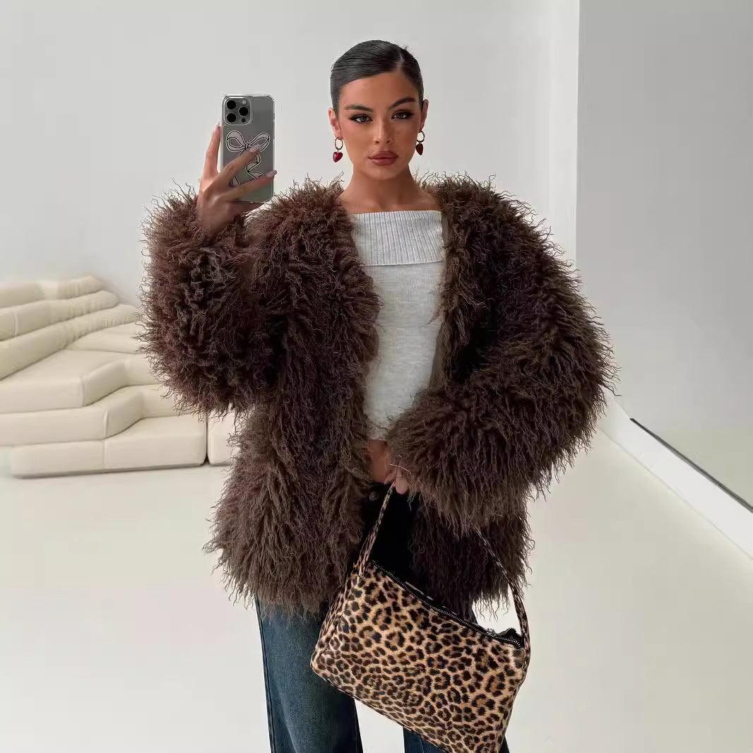 Chocolate-brown faux fur jacket with shaggy texture, open front, long sleeves.