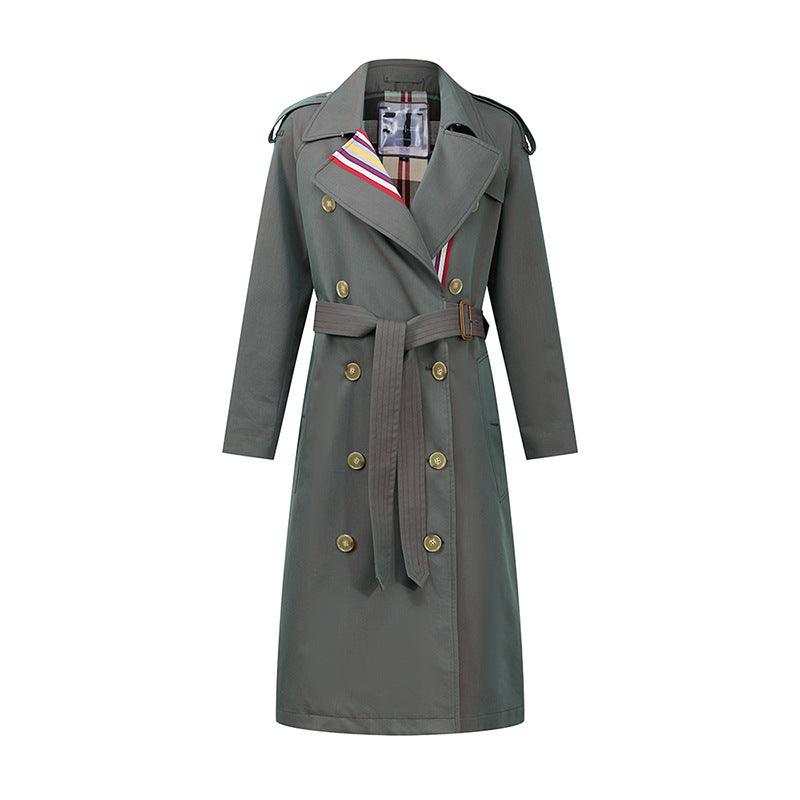 Olive double-breasted trench coat with color-stripe detail, tie belt, and gold buttons