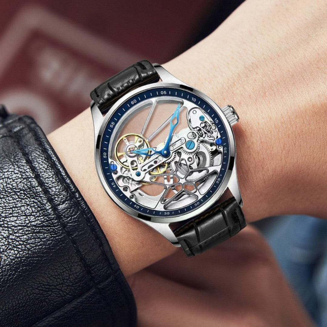 Automatic skeleton mechanical watch with black leather strap, silver case, blue accents