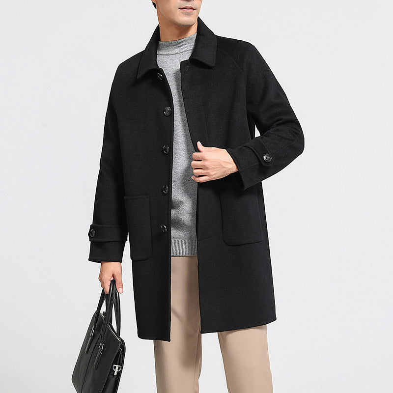 Men's reversible wool coat in black, button front, flap pockets, shown with inner lining.