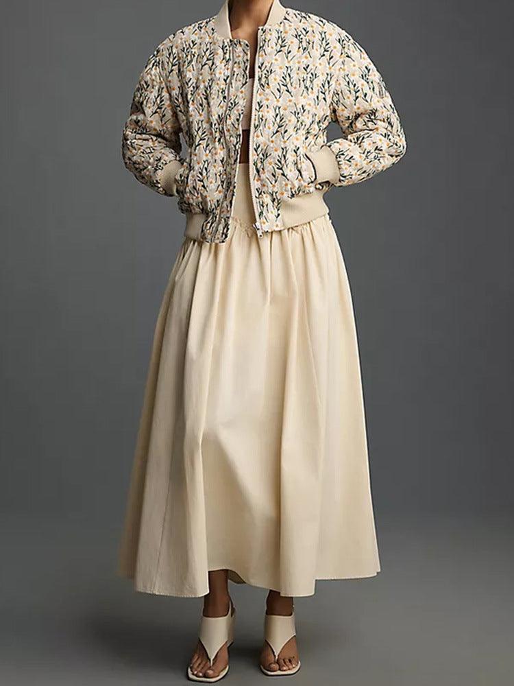 Beige floral zip-up jacket with ribbed cuffs and hem, front zipper.