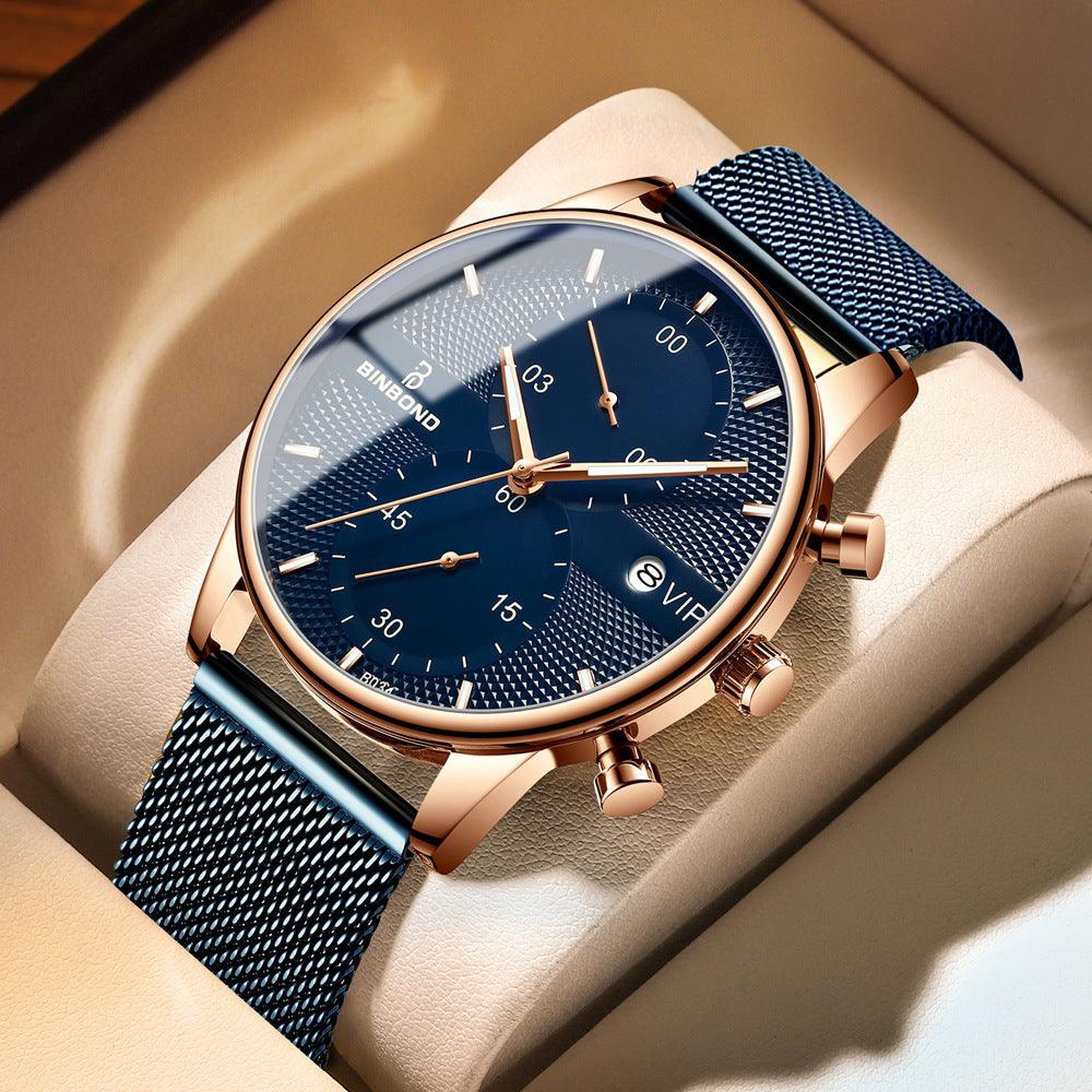 Rose-gold analog watch with blue textured dial and blue metal mesh strap