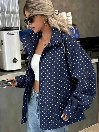 Navy polka-dot short coat with pointed collar and long sleeves, relaxed open front
