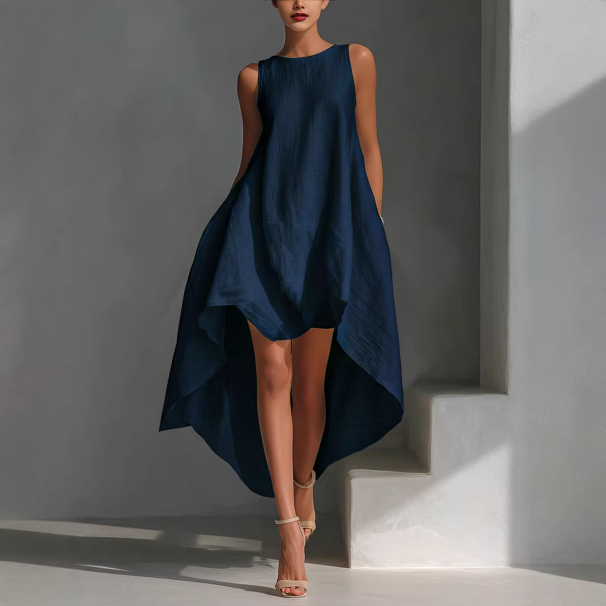 Navy sleeveless dress with irregular high-low hem and flared asymmetric panels