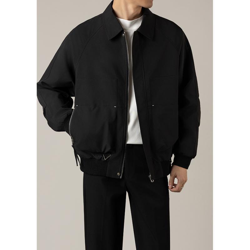 Black short lapel jacket with zip closure, flap pockets, drawcord hem