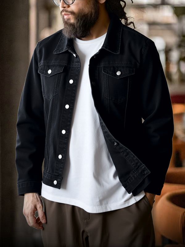 Black denim jacket with button front and chest flap pockets