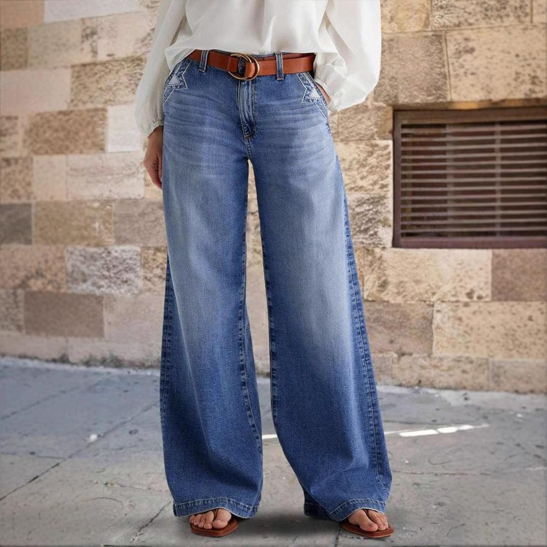 Blue denim straight pants with elastic waist, belt loops, and wide straight legs.