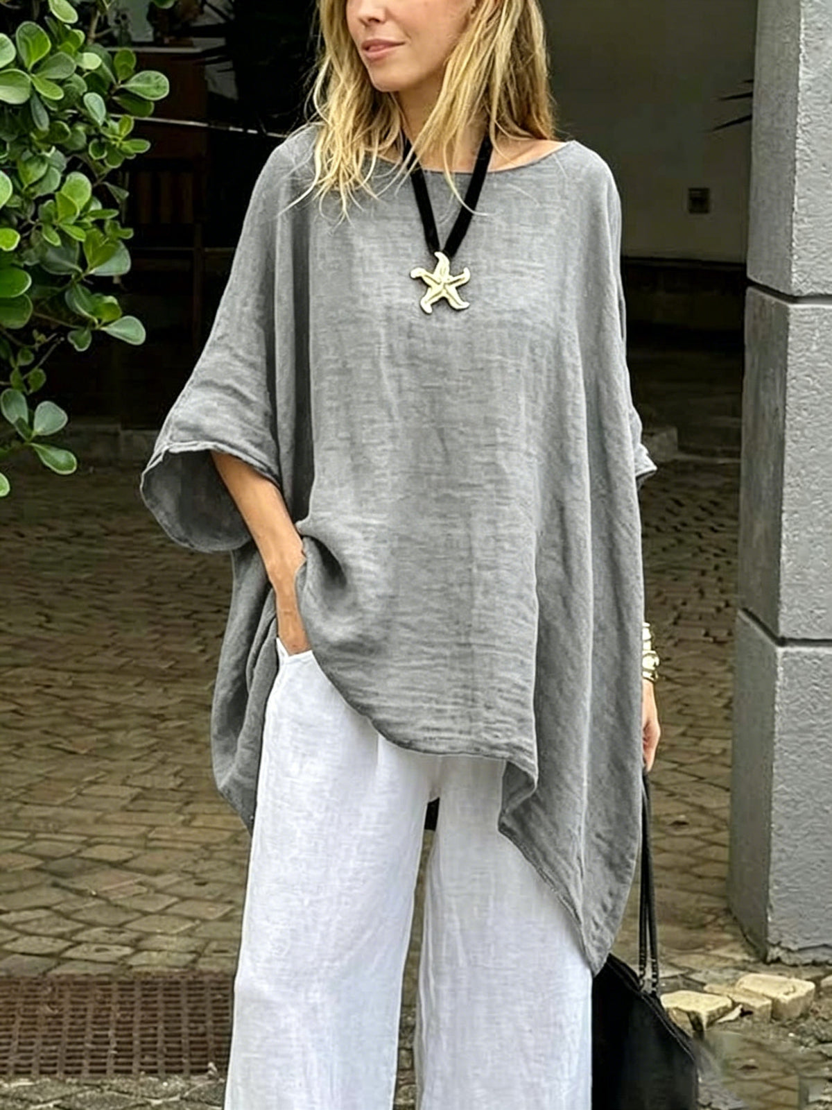 Womens solid round-neck casual top, heather gray, loose fit with draped asymmetric hem