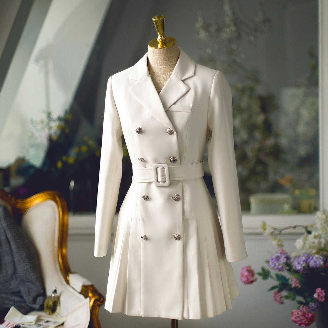 Beige double-breasted blazer with lapels and belted waist, pleated mini skirt hem