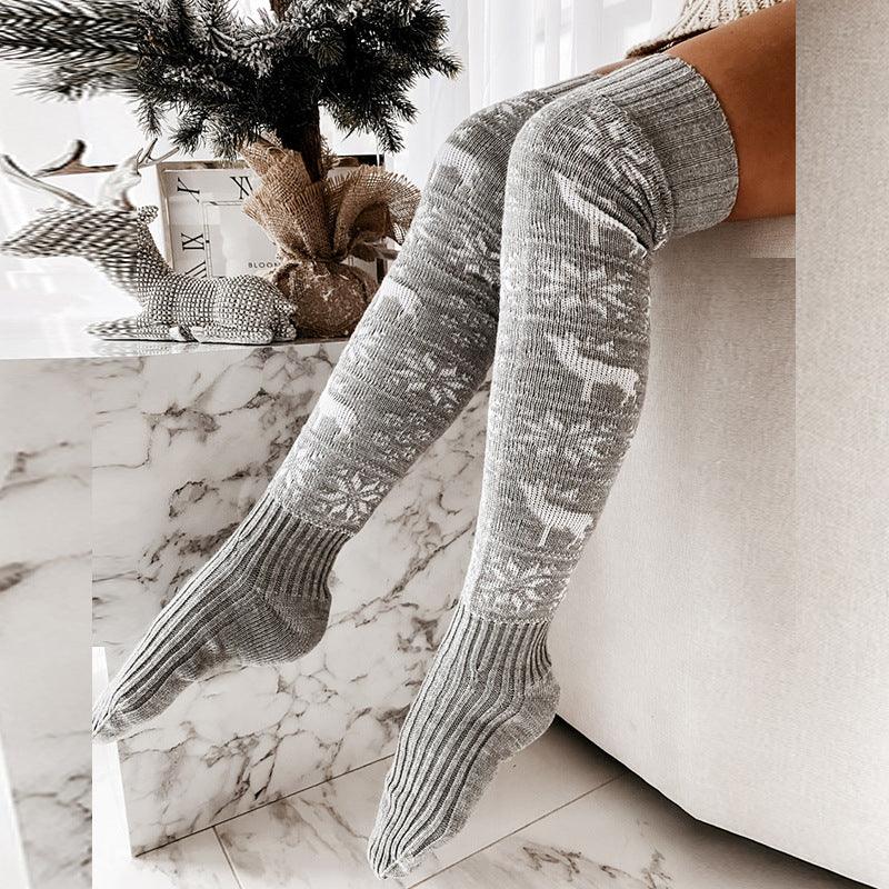 Gray patterned knee-high knit socks, full leg view