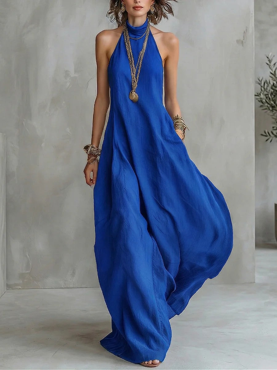 Royal blue halterneck maxi dress with off-shoulder neckline and loose flowing skirt