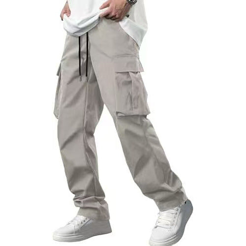 Men’s cargo drawstring pants in light gray with multiple flap cargo pockets.
