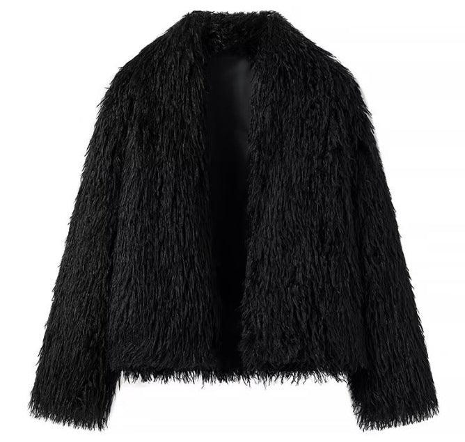 Black shaggy cropped jacket with open front and fuzzy texture, back view
