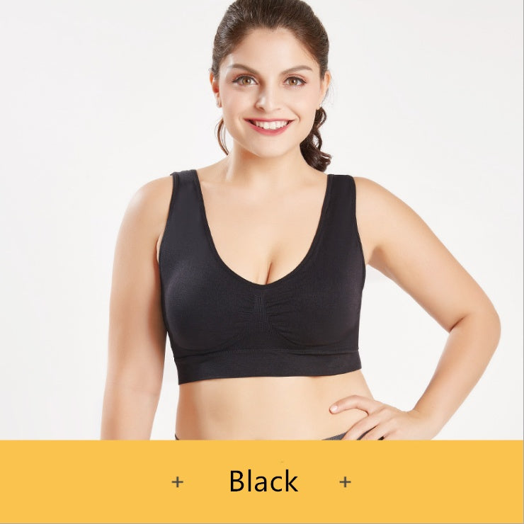 Black sports bra featuring scoop neckline and seamless molded cup design