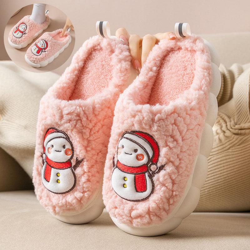 Pink plush snowman slippers with embroidered faces and striped heel tabs