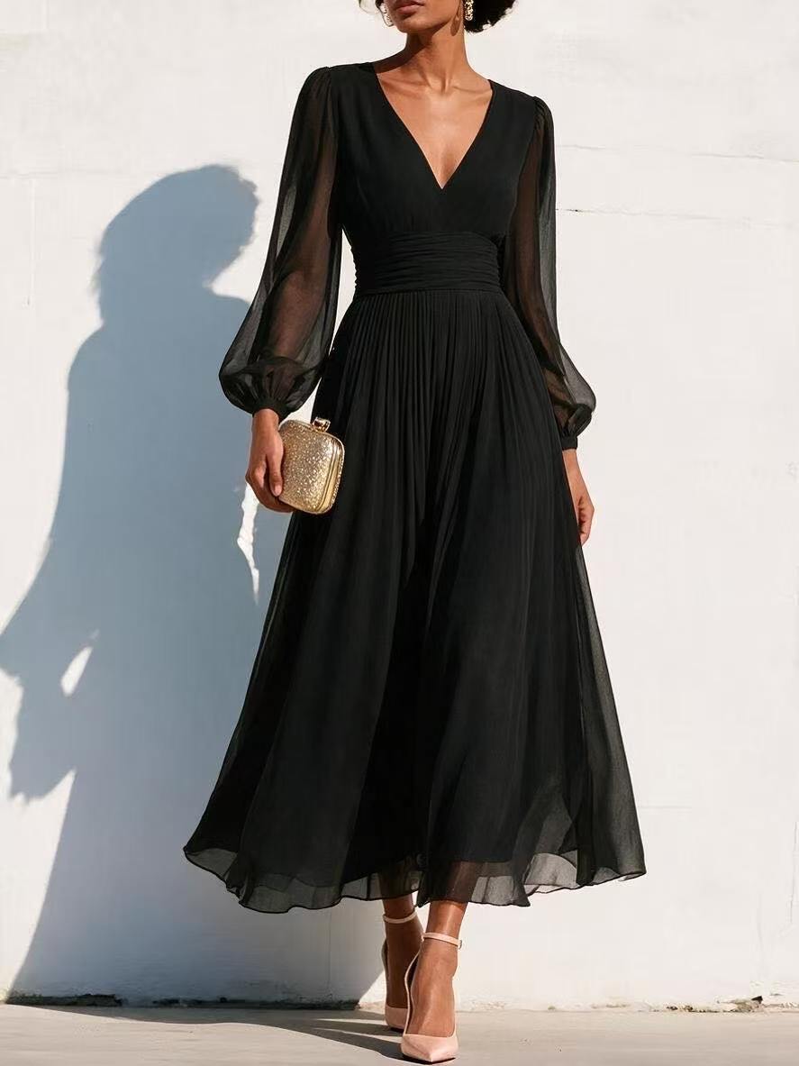 Fitted-waist pleated dress in black with V-neck and gathered pleat waist