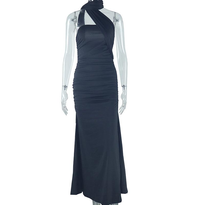 Dark halter backless ribbon split dress on mannequin, ruched column with long slit.