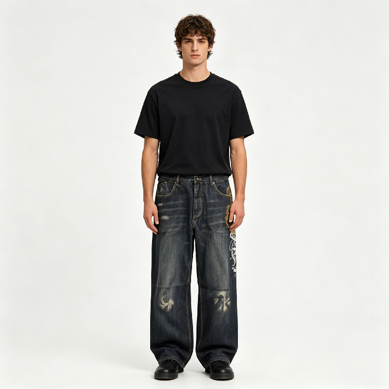 Washed dark denim straight wide-leg pants with white graphic on right leg