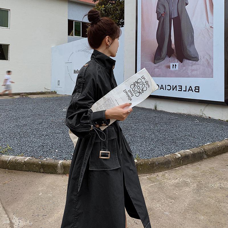 Black windbreaker jacket with hood, long cut, belt tie and flap pockets