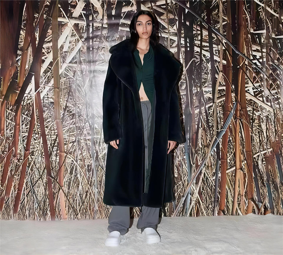 Black long plush trench coat with wide lapels and belt