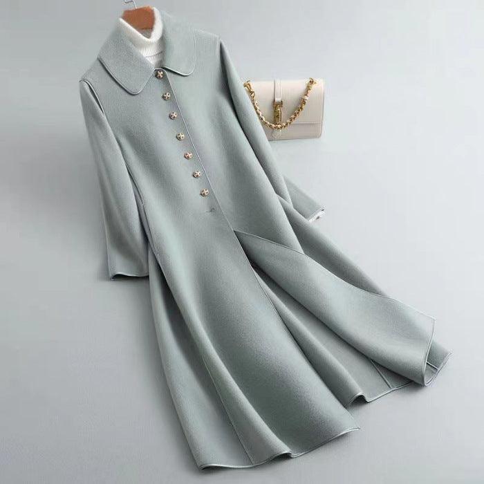 Light blue long below-knee coat with pointed collar and small metal button row