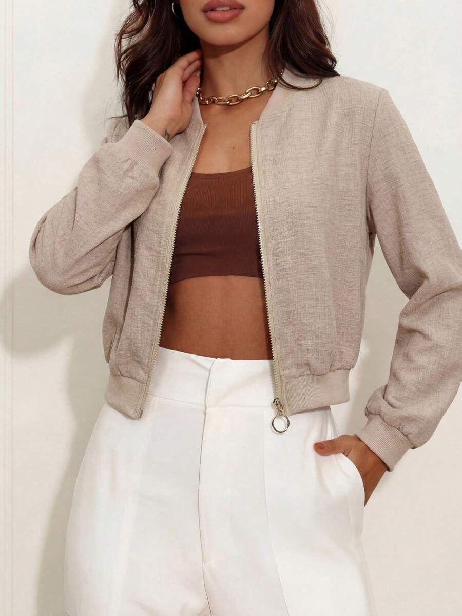 Light beige short zip-up jacket with long sleeves and front zipper