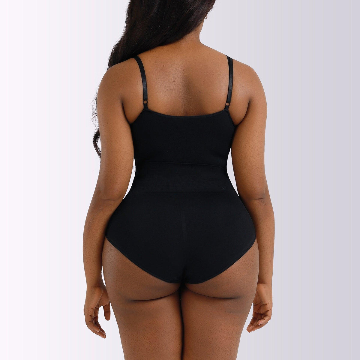 Black seamless postpartum bodysuit with thin back straps and full rear coverage