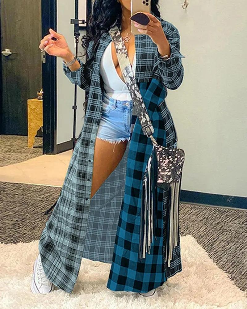 Long open-front plaid coat with fringed hem, teal and black check stripes.