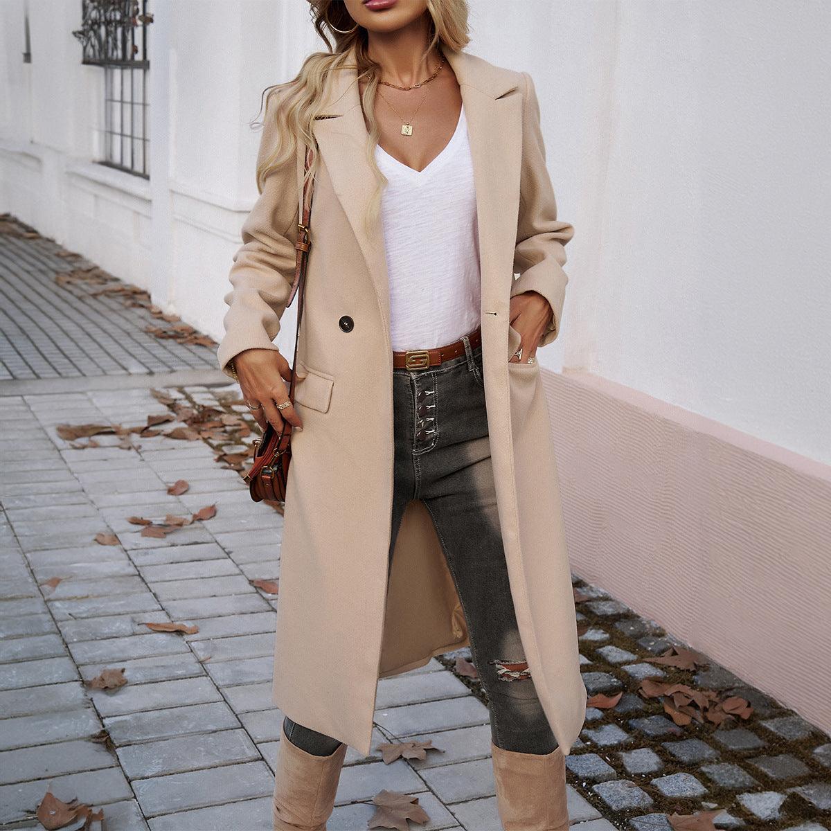Long beige turn-down collar coat with button front and flap pockets