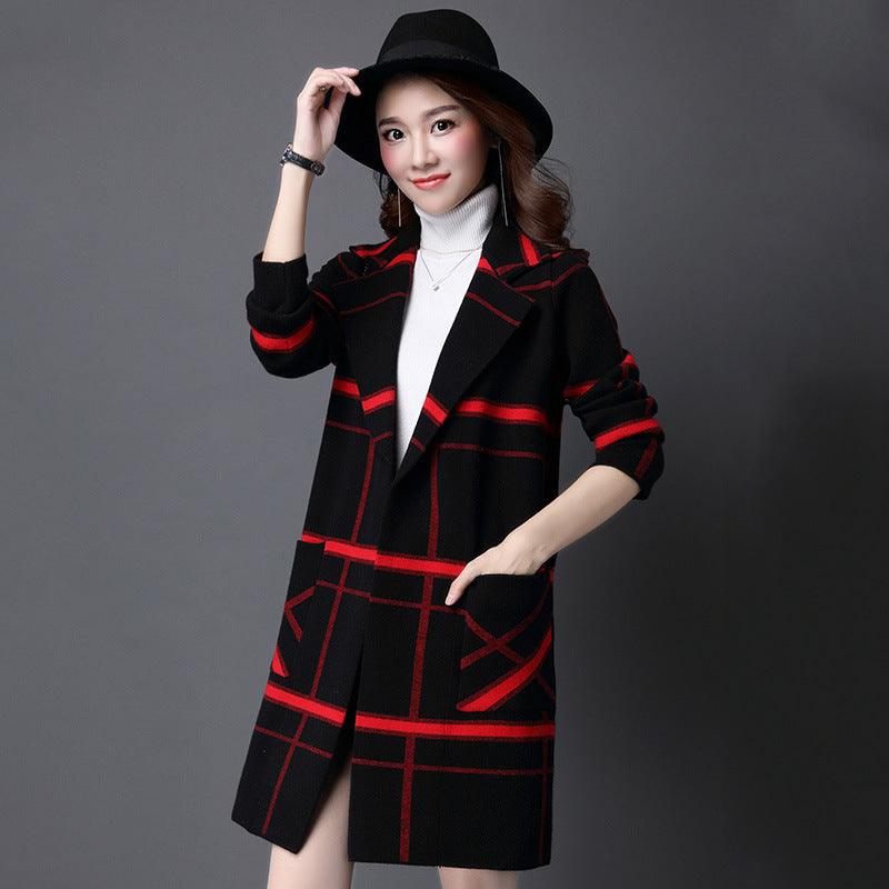 Black plaid sweater coat with red grid pattern, hood, and long sleeves