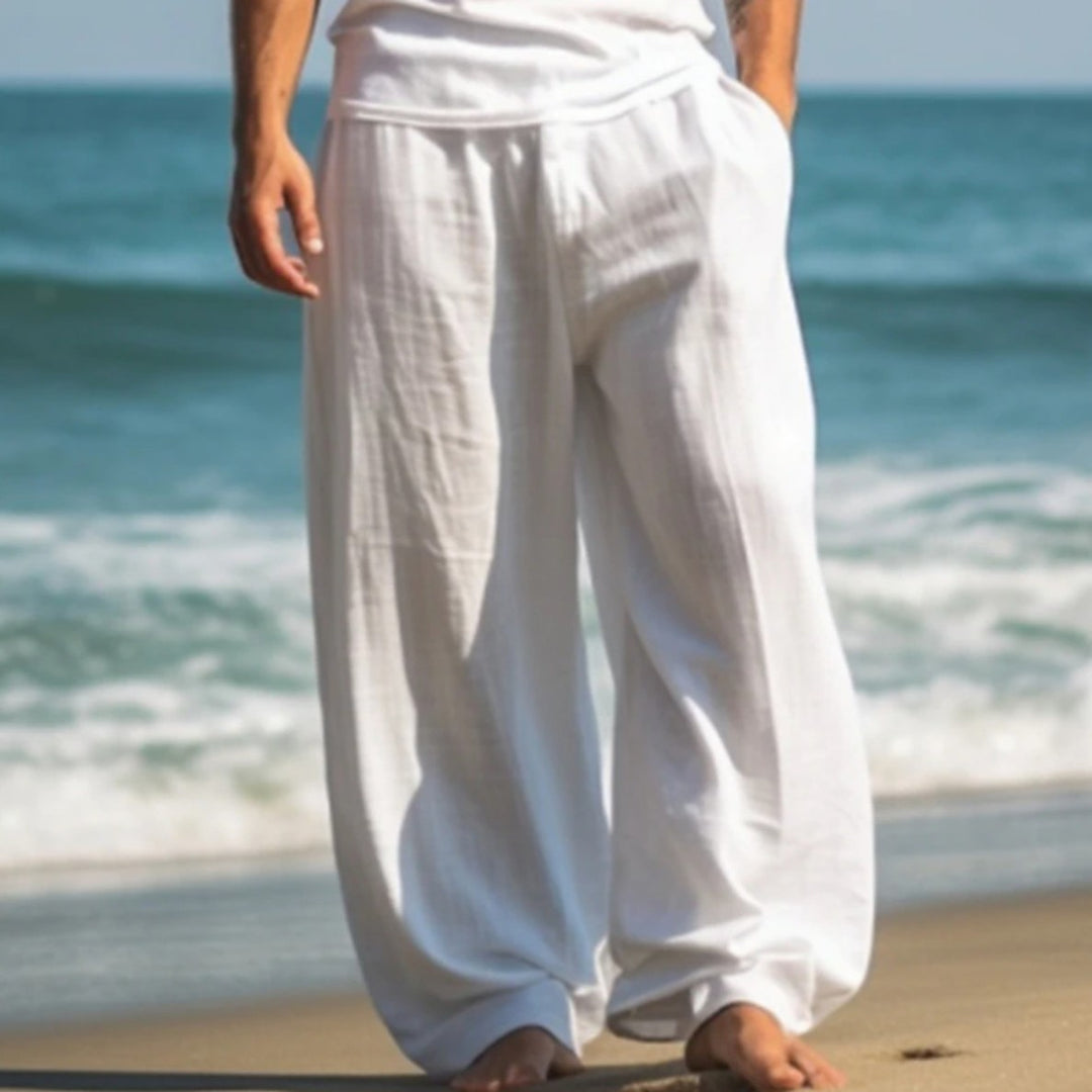 White straight-leg beach pants with elastic waistband and side pockets
