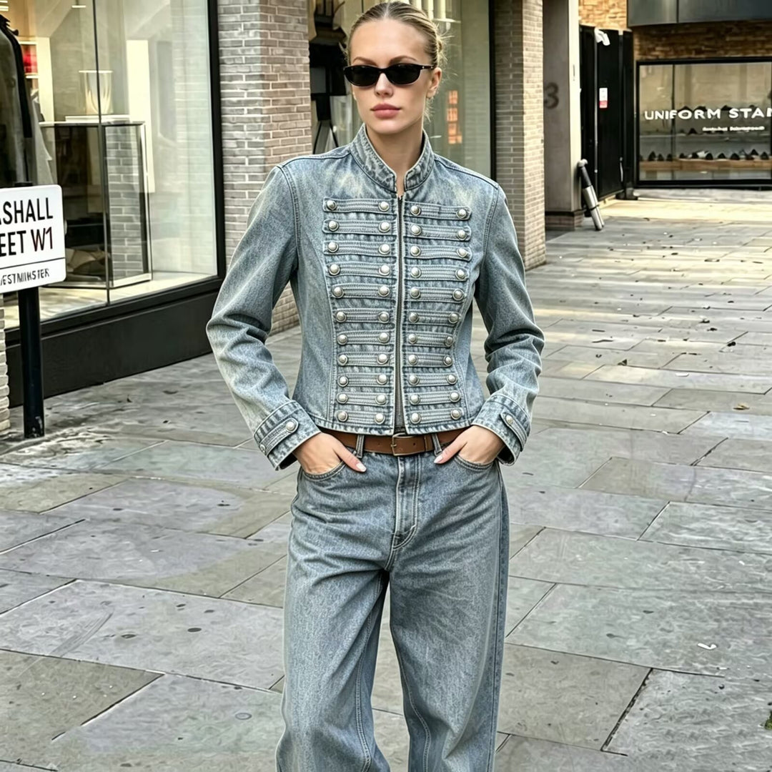 Women’s light blue denim jacket with silver button trim and front snap closure