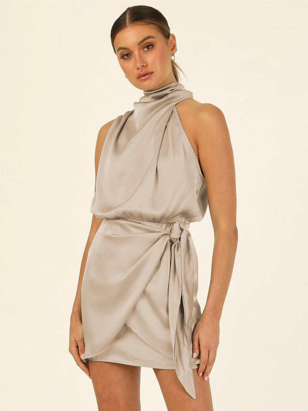 Satin halter mini dress in beige with draped neckline and tie waist sash