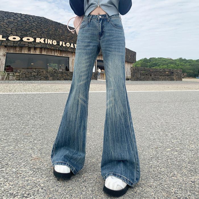 Light blue bell-bottom jeans showing wide flare, belt loops, and faded front panel.