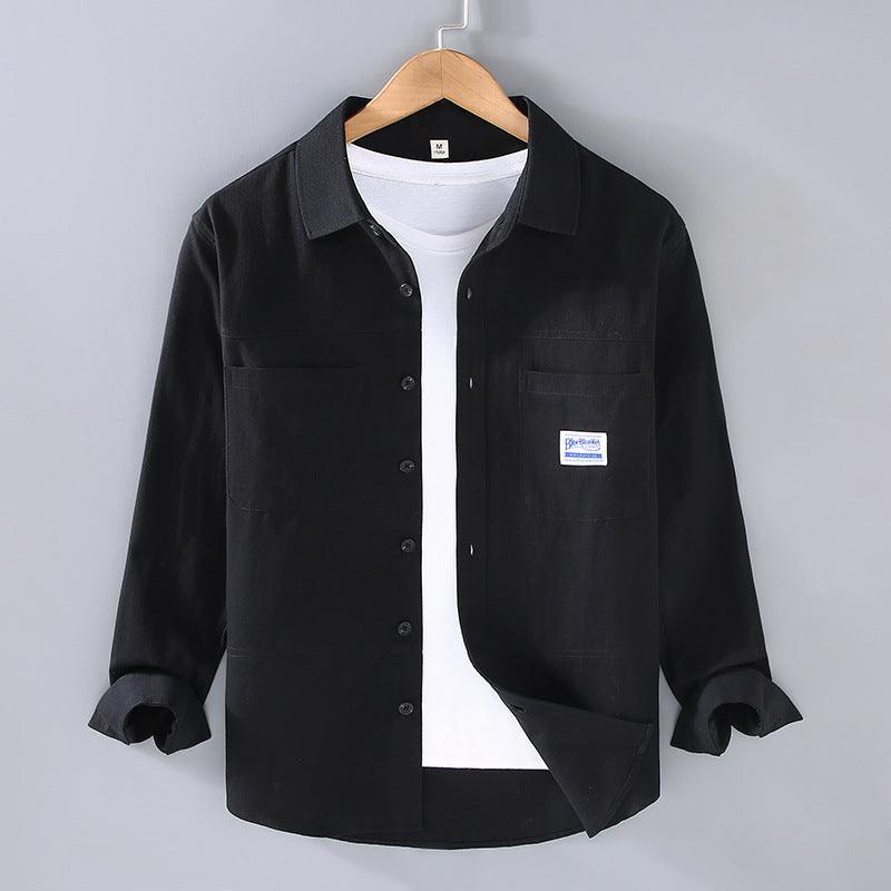 Black youth button-up shirt jacket with chest pockets, long sleeves, button cuffs