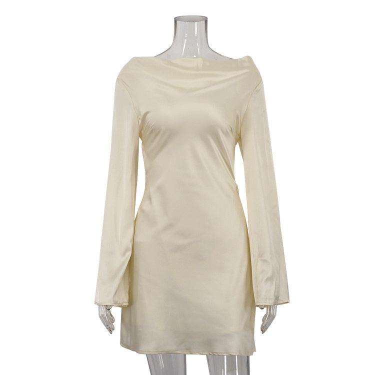 Pale yellow satin mini dress with long sleeves and scoop neckline, fitted waist