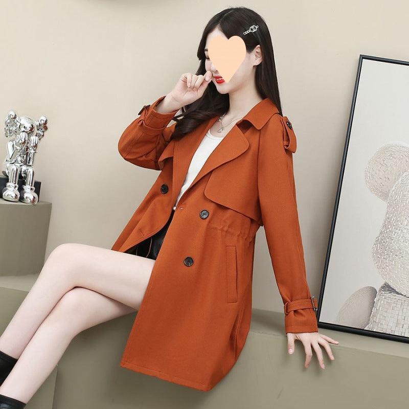 Women's mid-length trench coat in rust orange, loose fit, double-breasted buttons, flap pockets