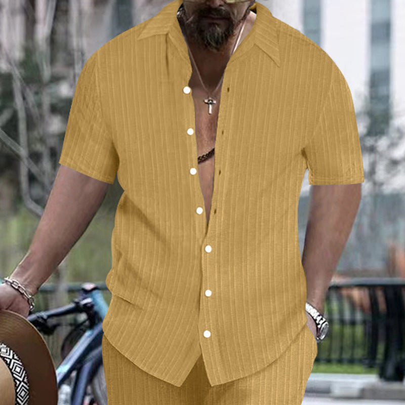 Mustard yellow short-sleeve button-up shirt with vertical stripes and open collar