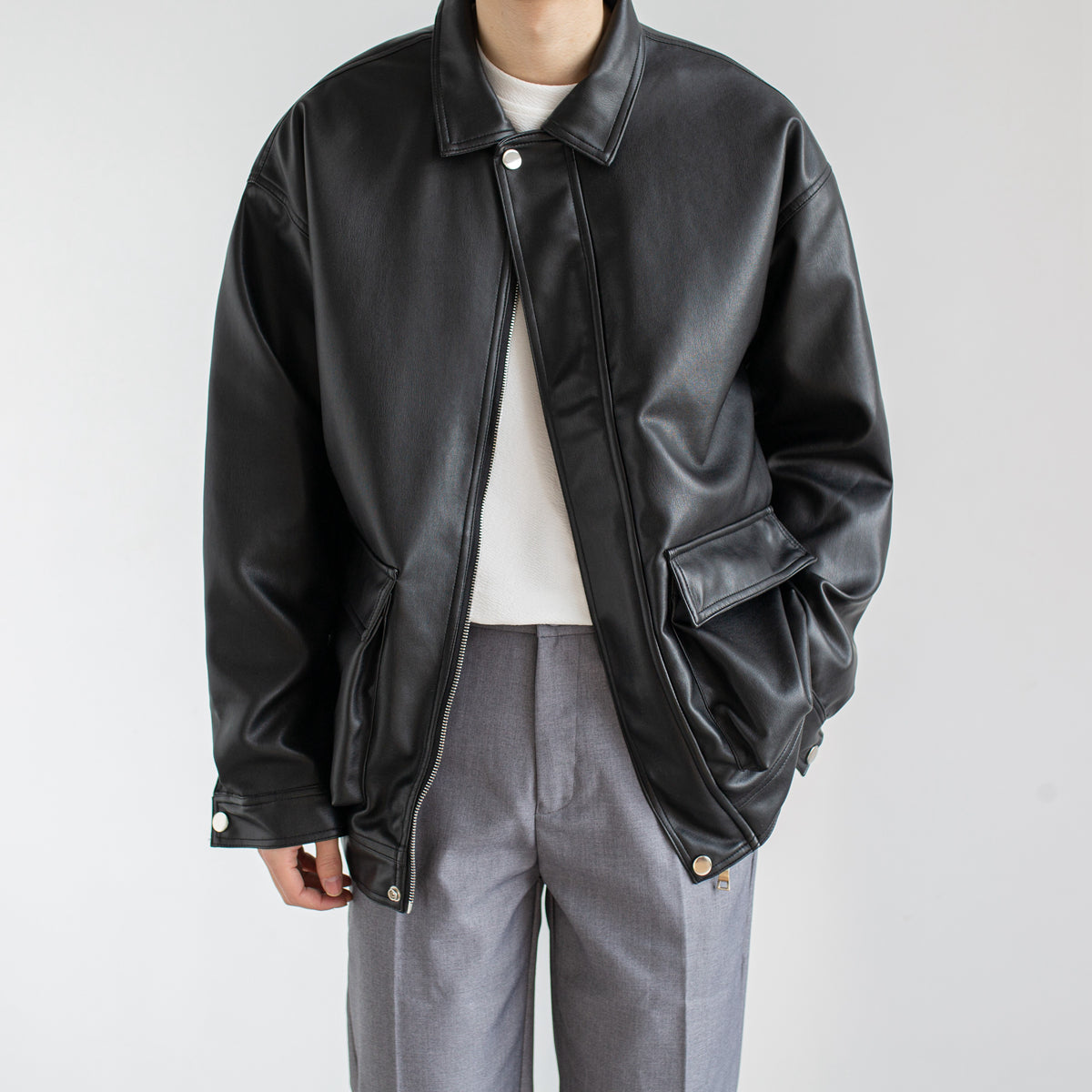 Men's black single-breasted faux leather jacket
