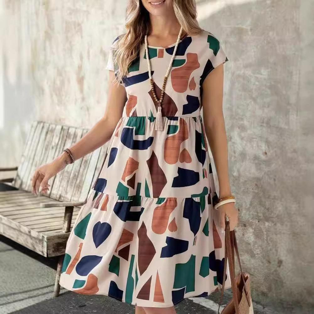 Women's multicolor geometric print casual dress, cap sleeves, round neck, flowing skirt, side view