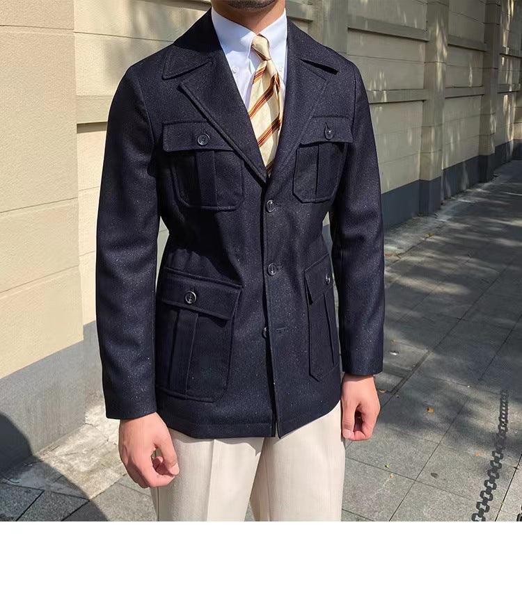 Men's black high-collar suit jacket with flap pockets and button front