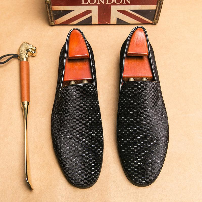 Pair of men's driving loafers, black textured uppers with orange-brown lining and flat soles
