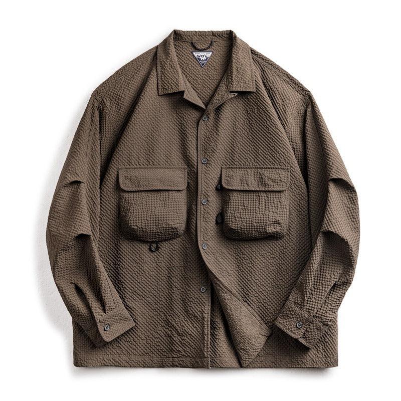 Brown long-sleeve seersucker shirt with point collar, button placket, flap chest pockets