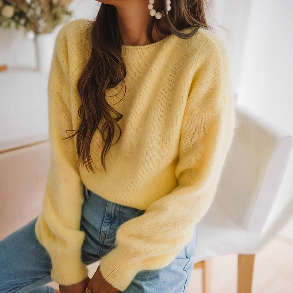 Yellow knit sweater with crew neck and loose long sleeves